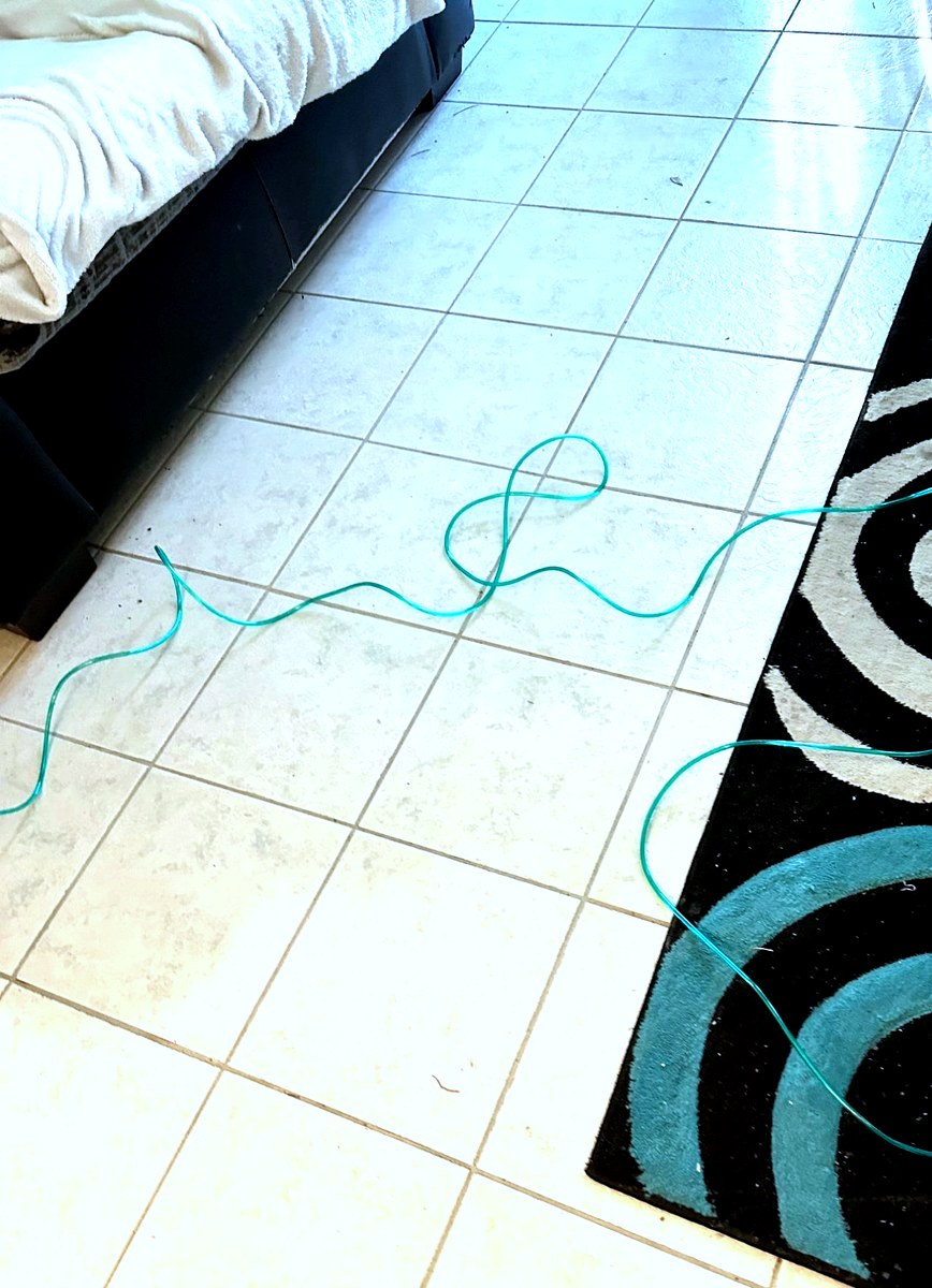 Oxygen tubing draped across floor — a trip hazard
